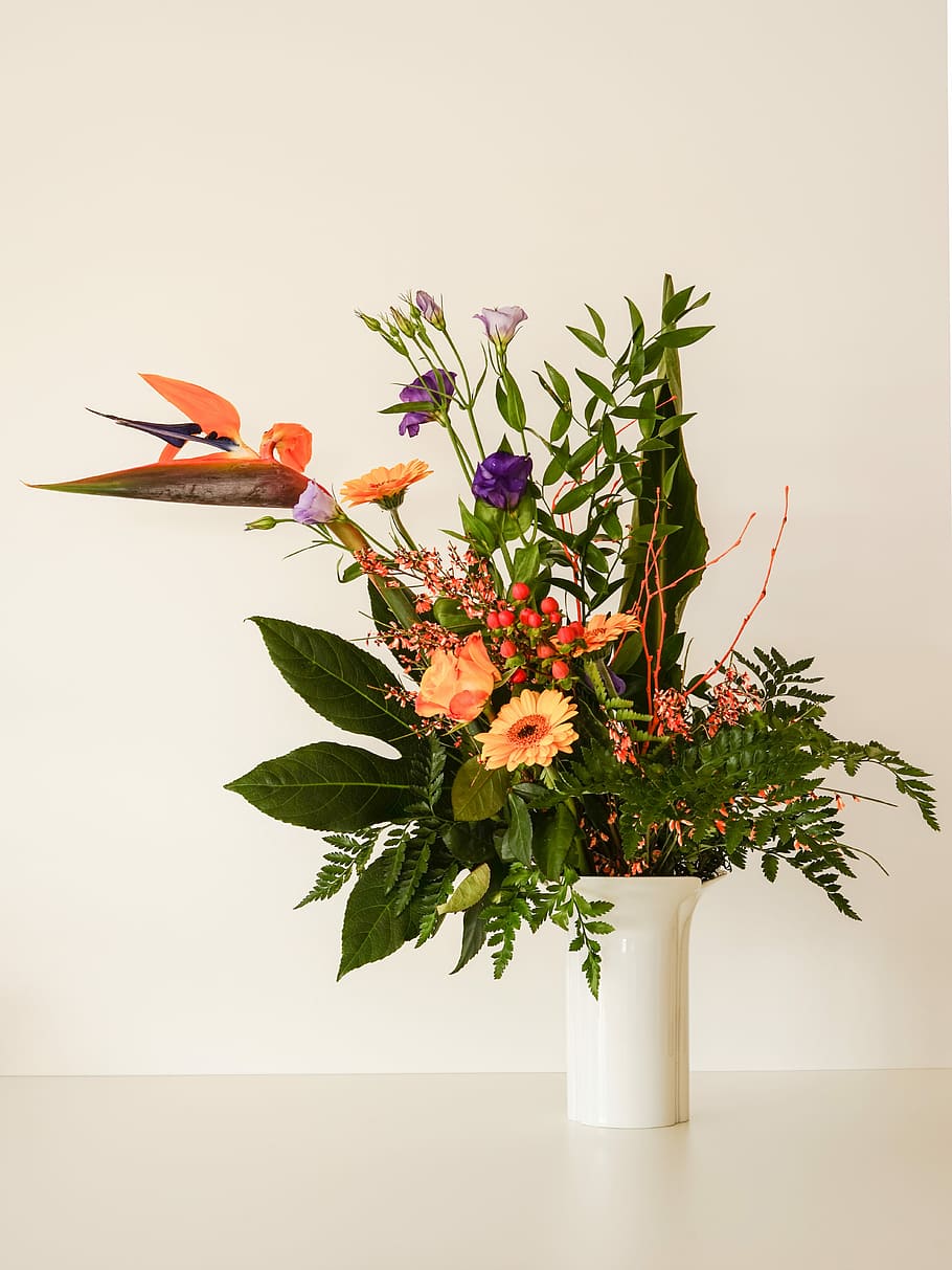 assorted-color-and-type flowers centerpiece, beige, surface, bouquet, caudata, bellflower, rose orange, gerbera orange, aralia leaf, porcelain vase white