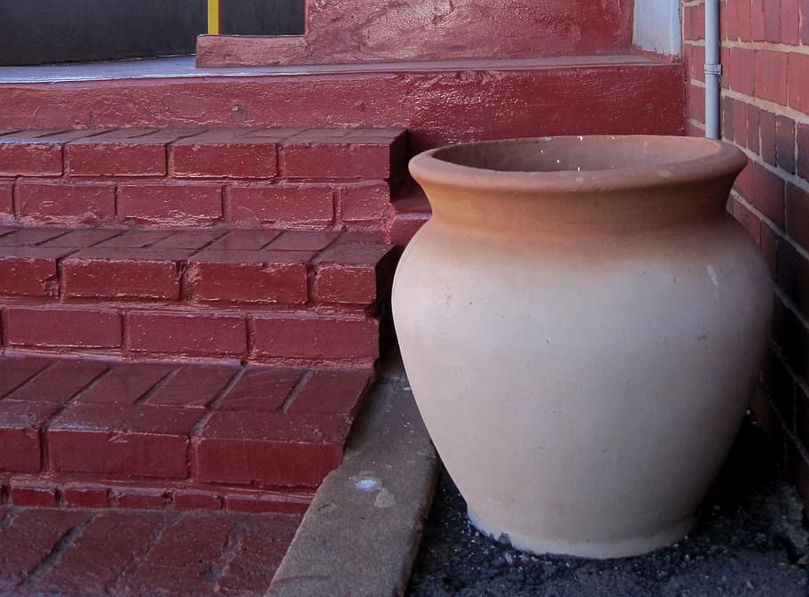 pot, clay, large, cream colored, terracotta edge, red steps, red brick wall, brick, brick wall, wall