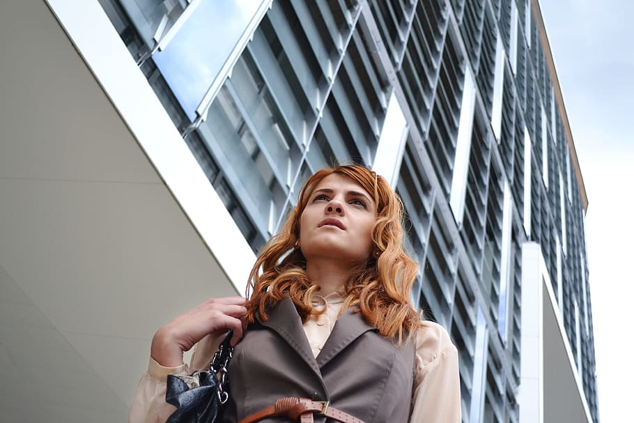 woman, white, grey, concrete, building, daytime, business woman portrait, outdoors business center, business, portrait