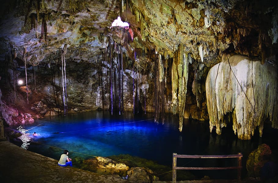 person, sitting, inside, cave, cenote, sacred, yucatan, real people, illuminated, rock