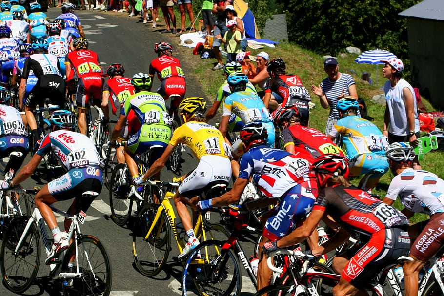 cyclists, riding, road bikes, daytime, tour de france, yellow jersey, polka dot jersey, montain jersey, american champion, leader