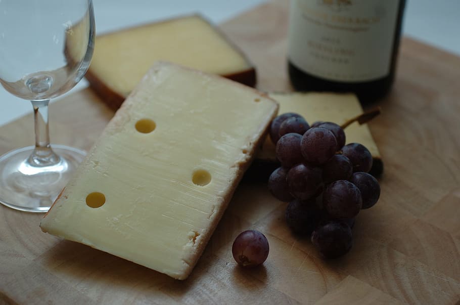 grapes, cheese, wine glass, bottle, wooden, surface, wine, food, food and wine, glass