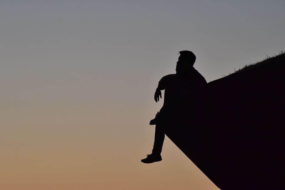 silhouette photography, man, sitting, cliff, looking, thinking, silhouette, portrait, black and white, be quiet