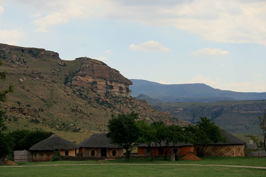 africa, village, rural, huts, rondavels, thatched roofs, mountains, landscape background, drakensberg, trees
