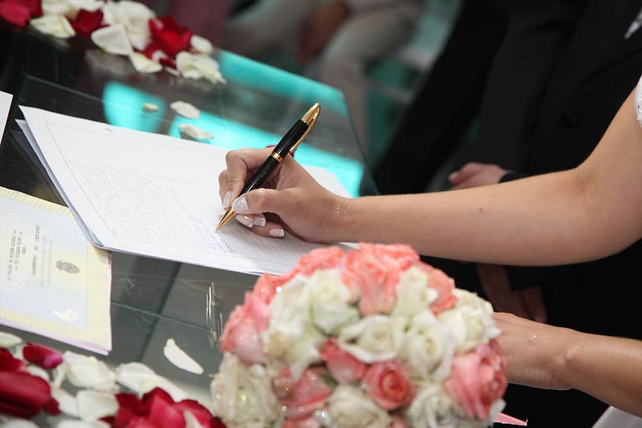 bride signing, wedding signature, signature, married, one person, human hand, real people, hand, holding, flower