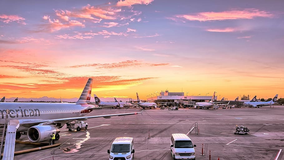 airliner on runway, airport, airplanes, gates, flight line, aviation, sunset, twilight, evening, dusk