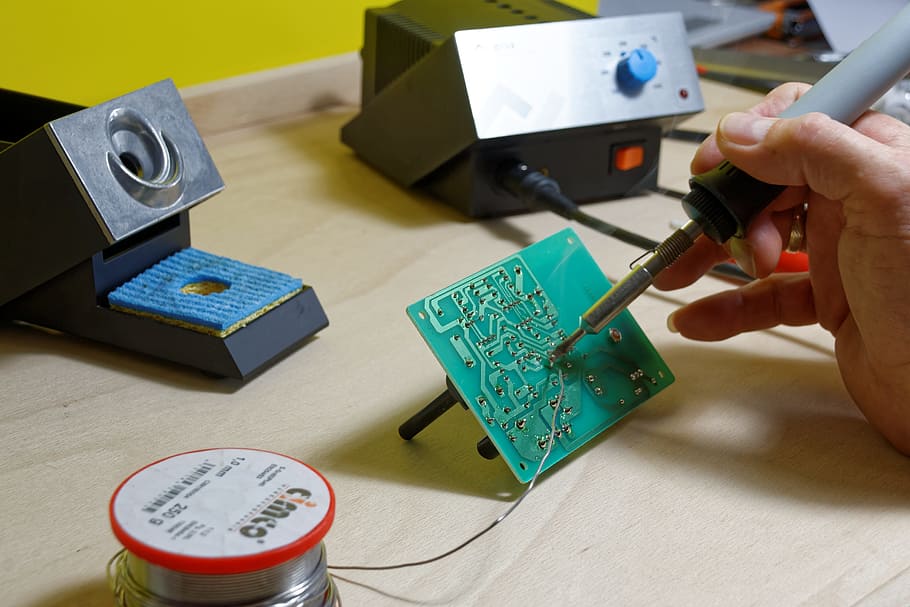 person, fixing, circuit board, using, soldering, iron, solder, soldering station, tin, board