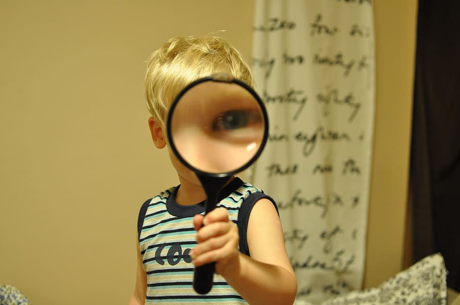 boy, holding, magnifying, lens, magnifying glass, child, funny, one person, indoors, portrait