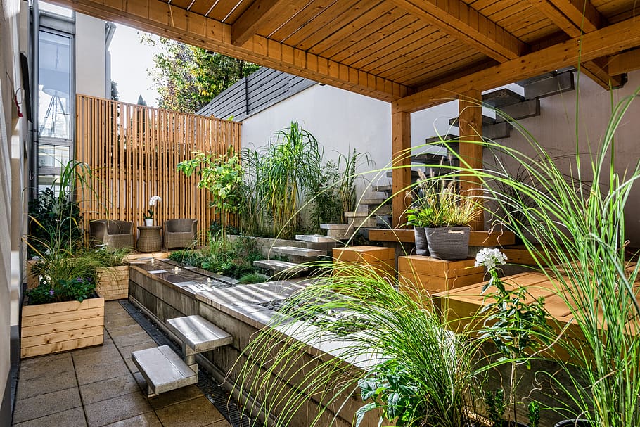 A sunny planted garden in a garden deck