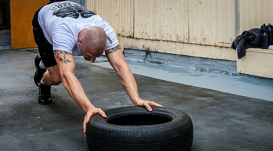 man, pushing, vehicle tire, tyre push, tire push, crossfit, hardcore training, gym, personal trainer, fitness