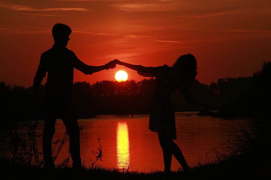 silhouette, man, woman dancing, sunset photo, couple, love, sunset, water, sun, shadow