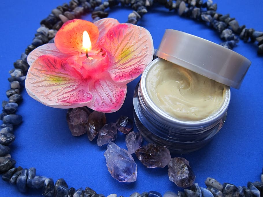 orchid candle, cream container, skincare, cream, balm, candle, wellness, amethyst, sodalith, moisturizer