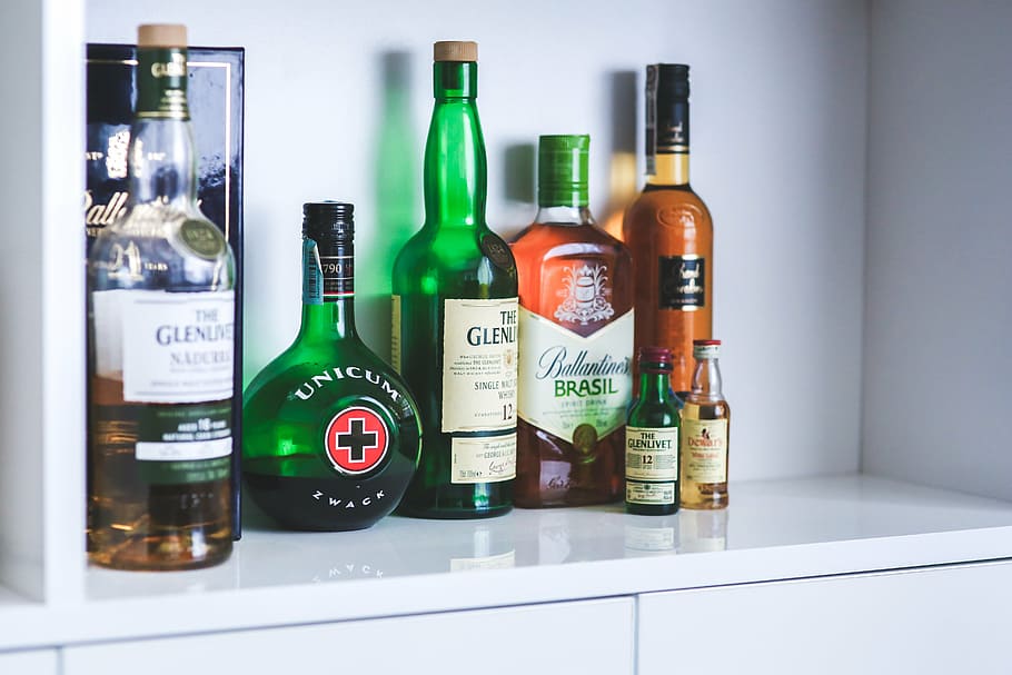 assorted-brand bottles, cabinet, bottles, bottle, whiskey, alcohol, alcoholism, party, drink, drinks