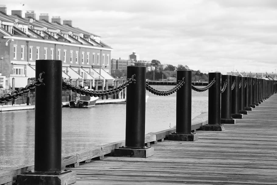 grayscale photography, wooden, dock, body, water, grey, scale, black, metal, posts