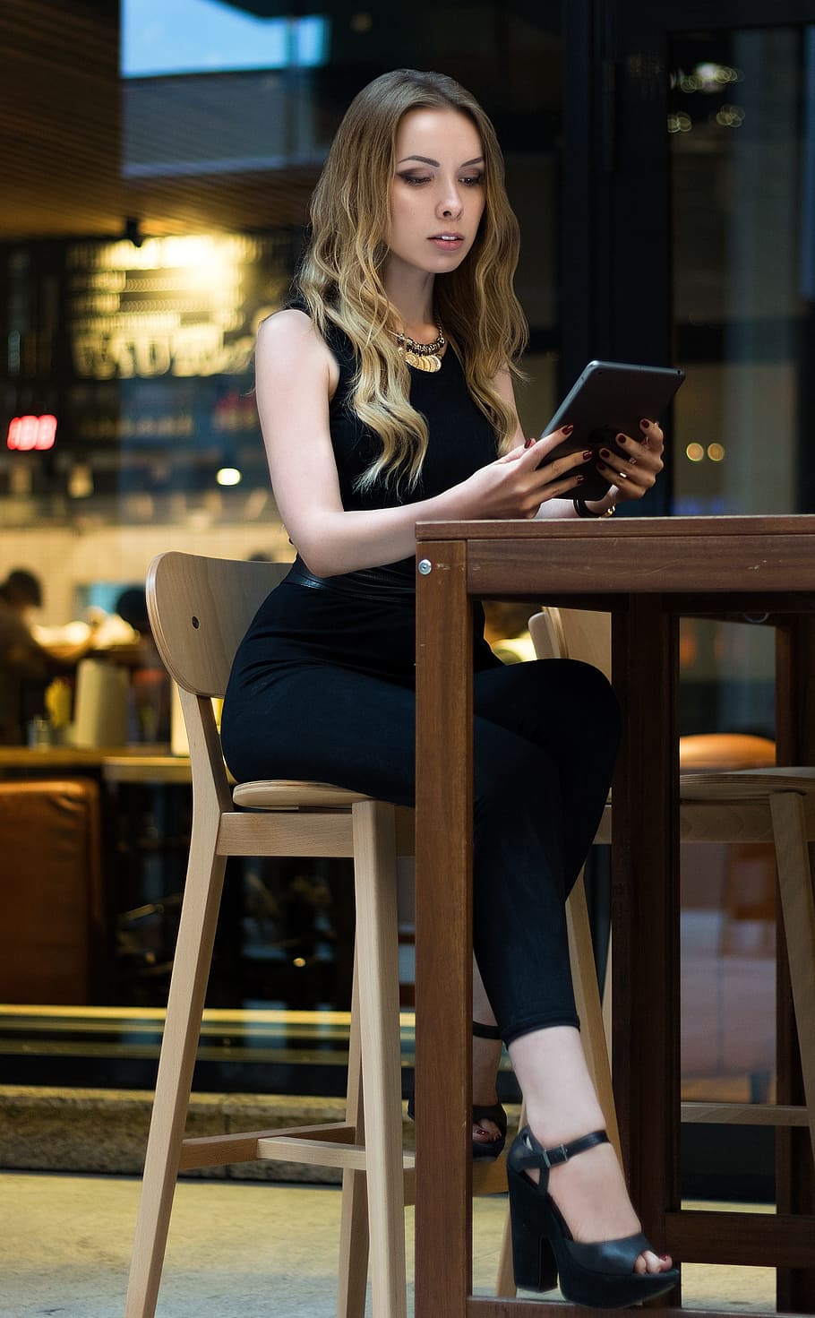 woman, sitting, bar stool, holding, tablet computer, girl, female, young, white, person