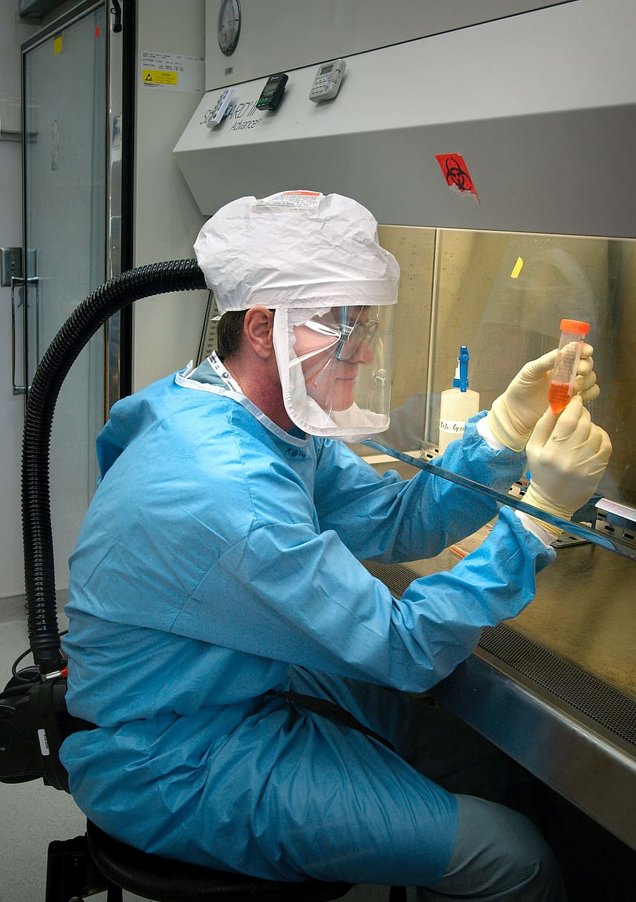 man, blue, overalls, beige, gloves, microbiologist, scientist, pathologist, laboratory, searcher
