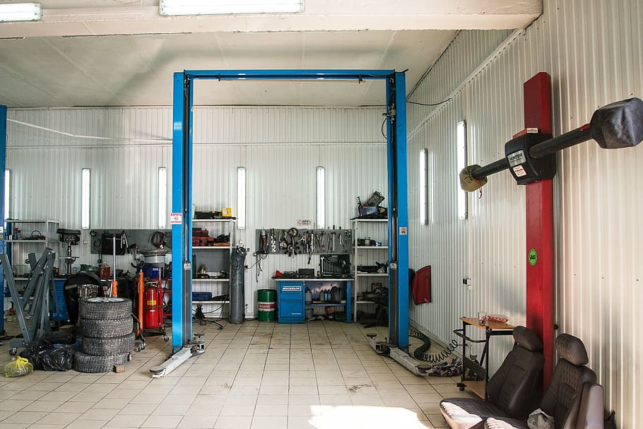 empty, blue, engine, hoist, inside, white, room, surrounded, assorted, vehicle tools