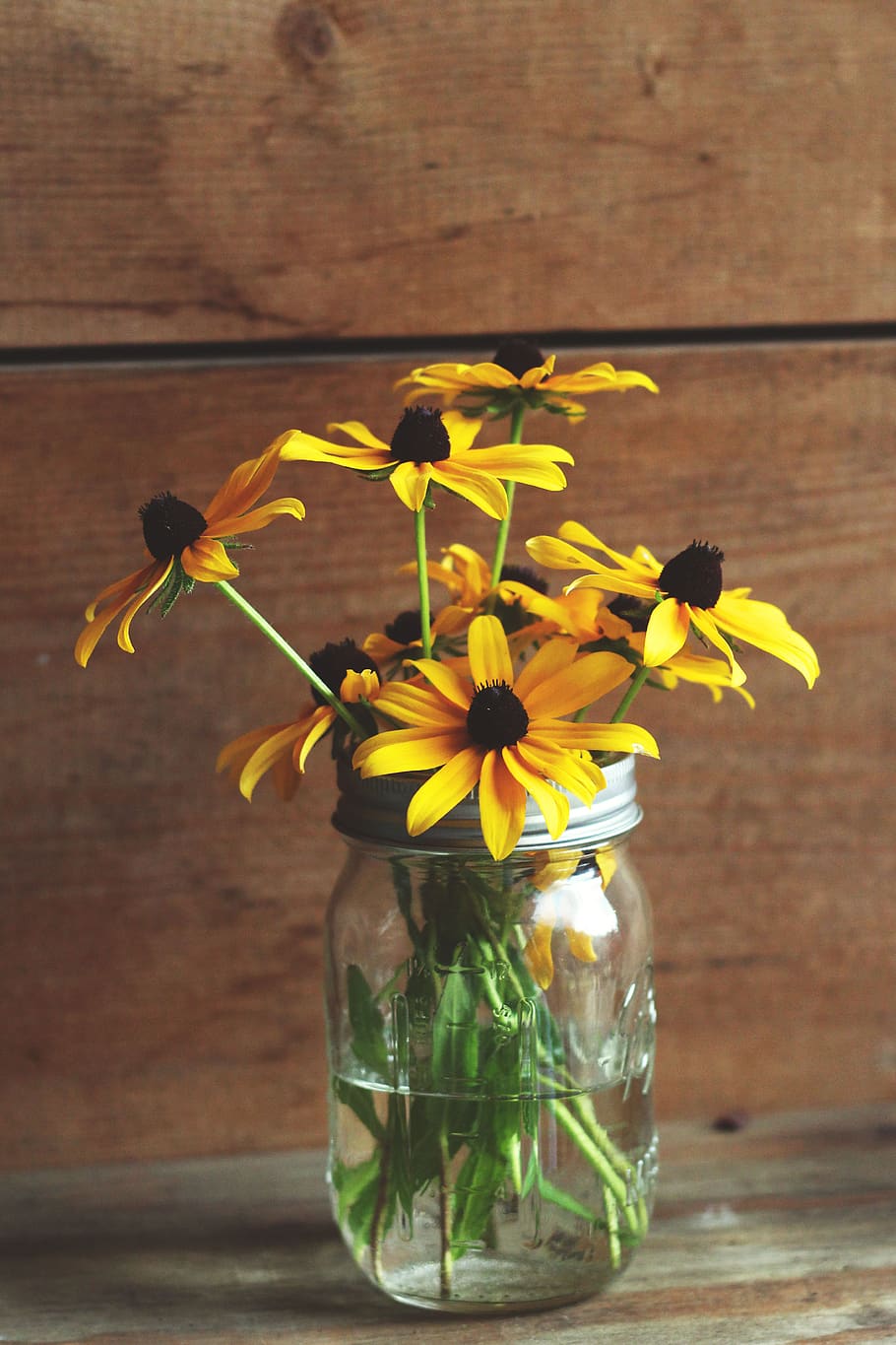 glass, jar, container, water, yellow, petal, flower, display, wooden, table