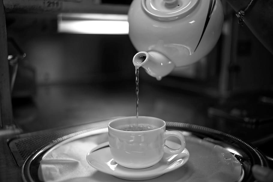 selective, focus photography, water, poured, pitcher, unto, white, ceramic, teacup, saucer