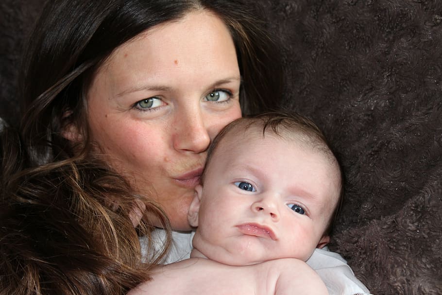 woman, brown, hair, carrying, baby, mother, kiss, family, mother and child, affection
