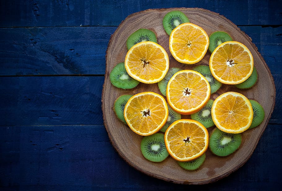 citrus, fruit, kiwi, brown, slab, orange, wood, table, blue, green