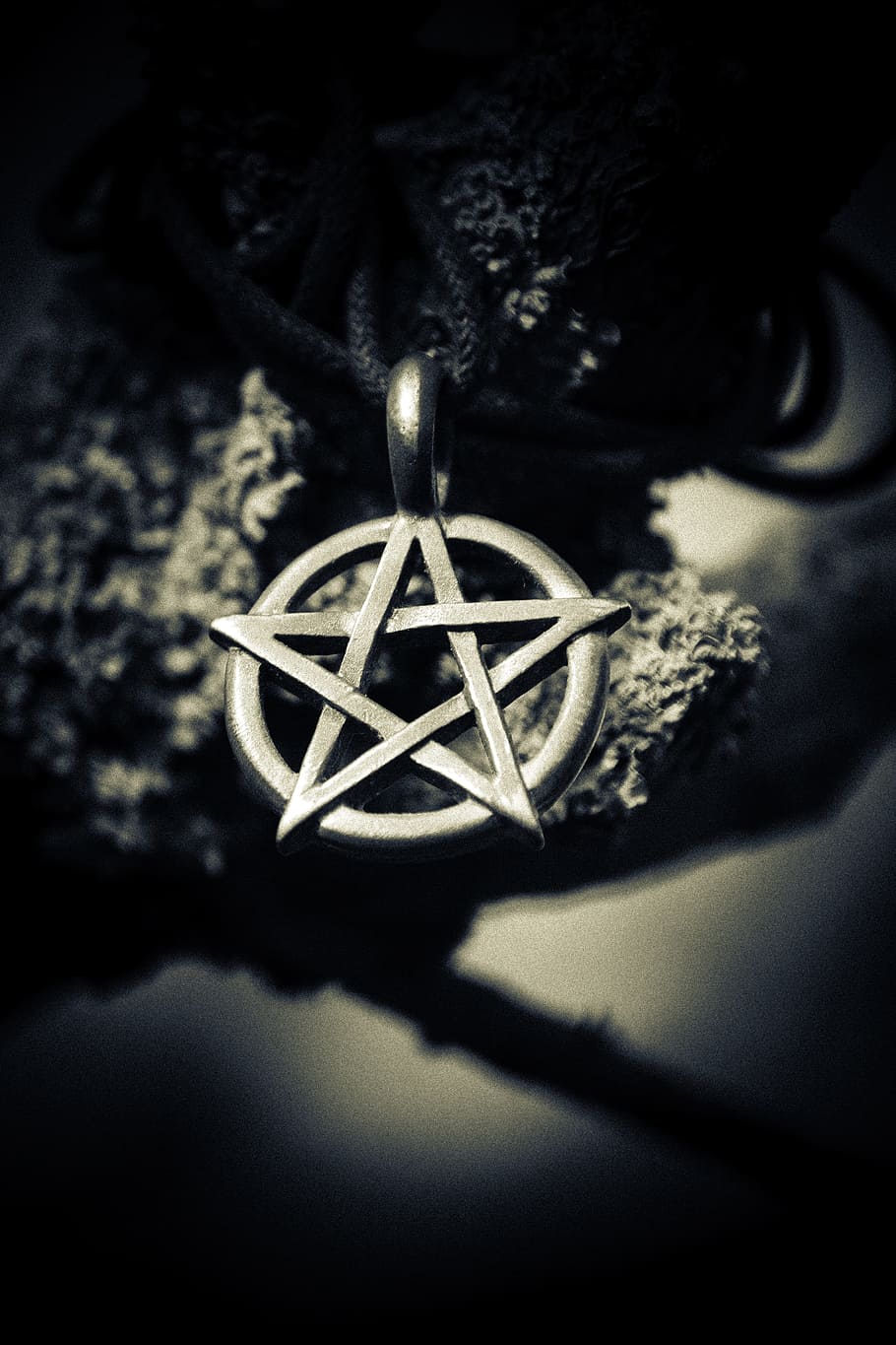 grayscale depth, field photography, star pendant, silver star, pendant, closeup photography, witchcraft, spooky, pentagram, halloween