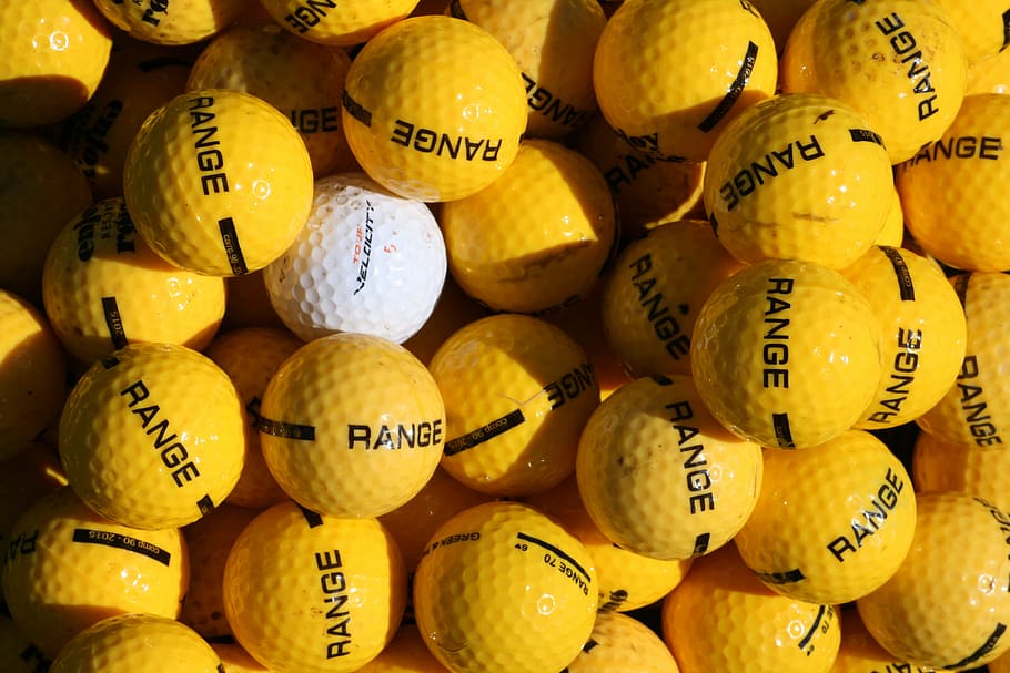 yellow, white, golf ball lot, different, unique, individual, crowd, alone, independent, imagination