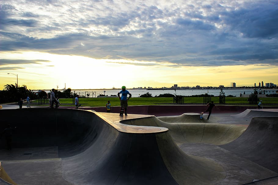 park, board, sunset, skateboard park, sky, sport, sports ramp, group of people, skateboard, leisure activity