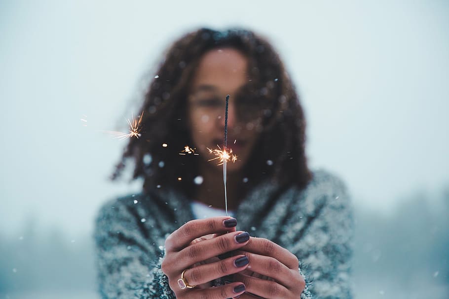 woman, holding, sparkler, hands, wearing, gray, coat, snowtime, people, female