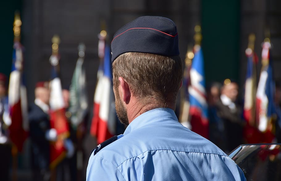 policeman, police, national holiday, 14 july, france, parade, 14, flags, rear view, focus on foreground