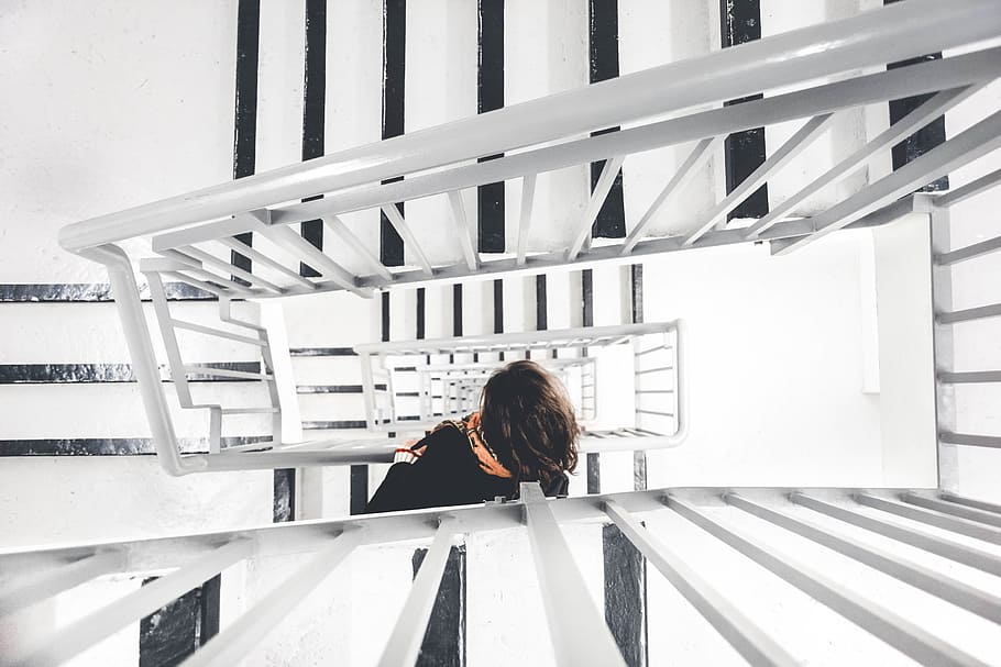 gray, metal stair handrail, stairway, stairs, interior, modern, downstairs, woman, real people, one person