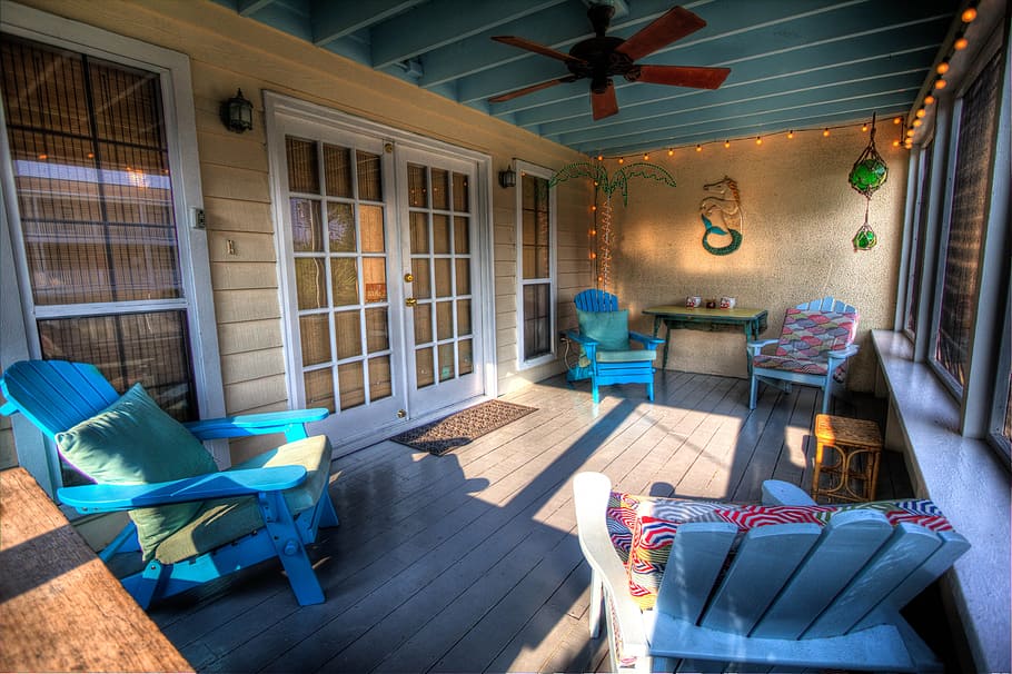 four, blue, wooden, adirondack chairs, placed, sliding, door, veranda, porch, verandah