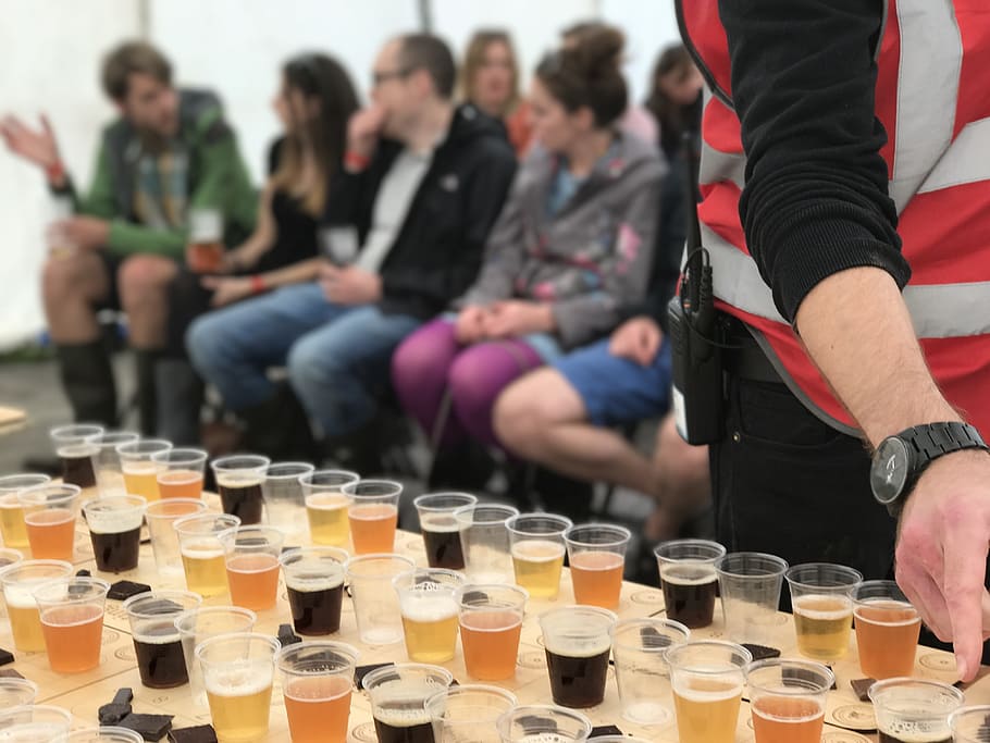 person, standing, table, beer festival, chocolate and beer pairing, chocolate, ale, alcohol, bar, beer