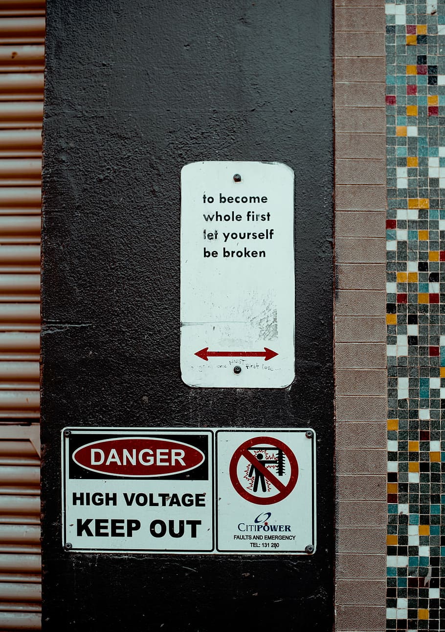 close-up, danger signage, black, wall, sign, left, right, warning, danger, communication