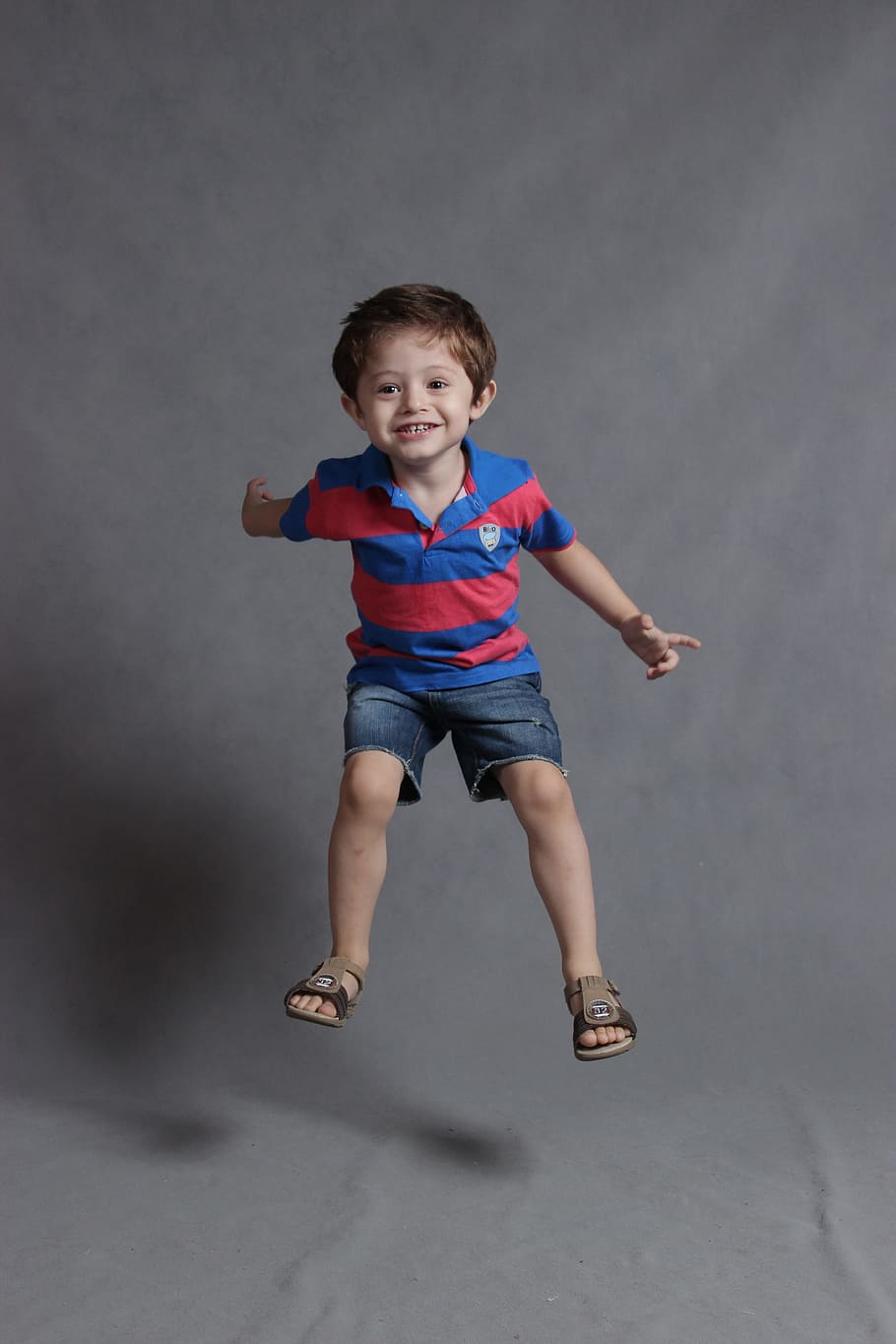 boy, blue, red, polo shirt, denim boat shorts, happy, smiling, child, full length, childhood