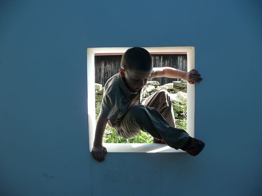 window, boy, game, unknown, blue wall, discovery, outdoor, one person, real people, casual clothing