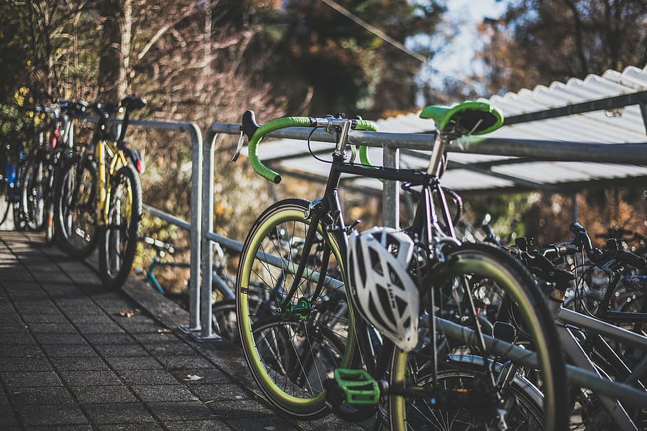 black, green, road bike, parked, gray, metal railing, bike, bicycle, sport, hobby