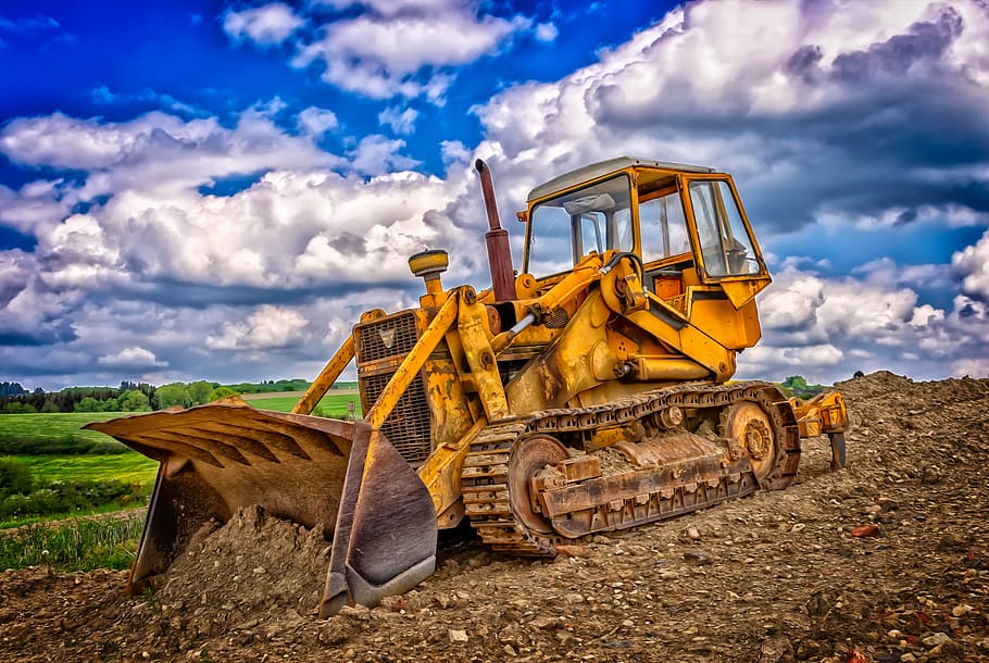 yellow, payloader, surrounded, plants, cloudy, sky, construction machine, caterpillar, tracked vehicle, slide