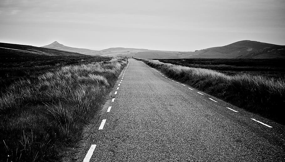 grayscale photography, empty, road, rural, country, fields, grass, plants, mountains, hills