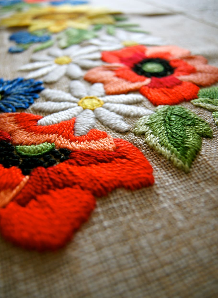 shallow, focus photography, assorted-color, floral, embroidered, textile, fabric, yarn, blanket, flower