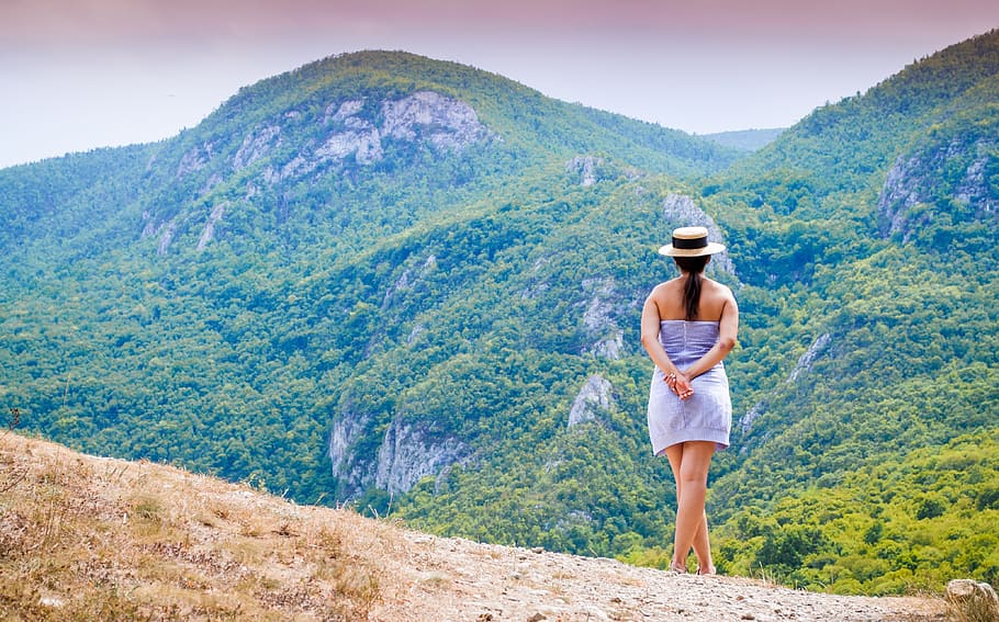 woman, blue, strapless dress, looking, mountains, daytime, nature, girl, thinking, hat