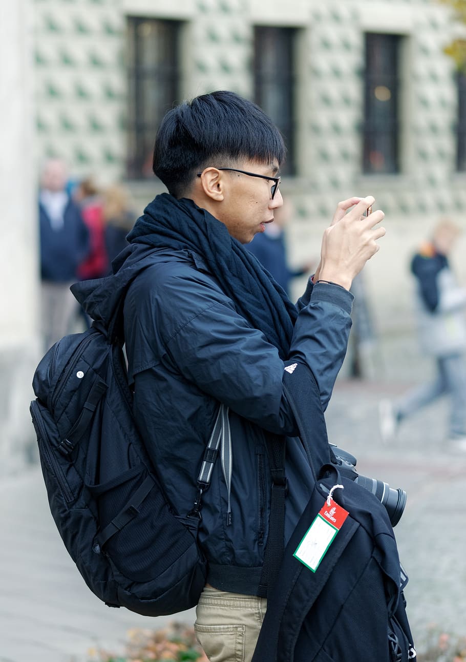 boy, man, person, young, asian, looking, glasses, backpack, equipment, the room