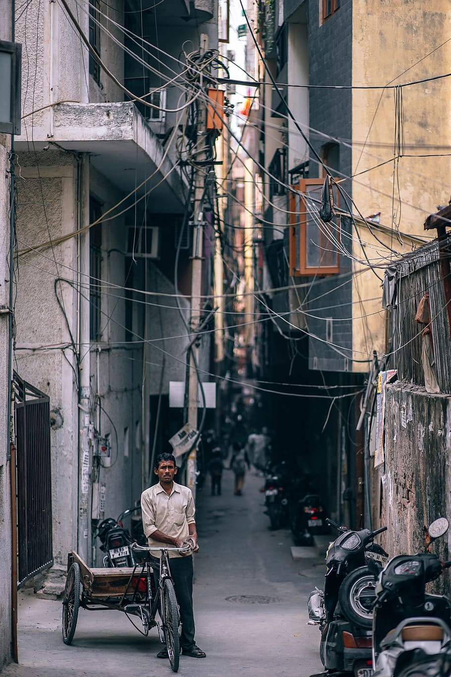man, leaning, trike, electricity cables, asia, asian, bazaar, bicycle, bike, blur