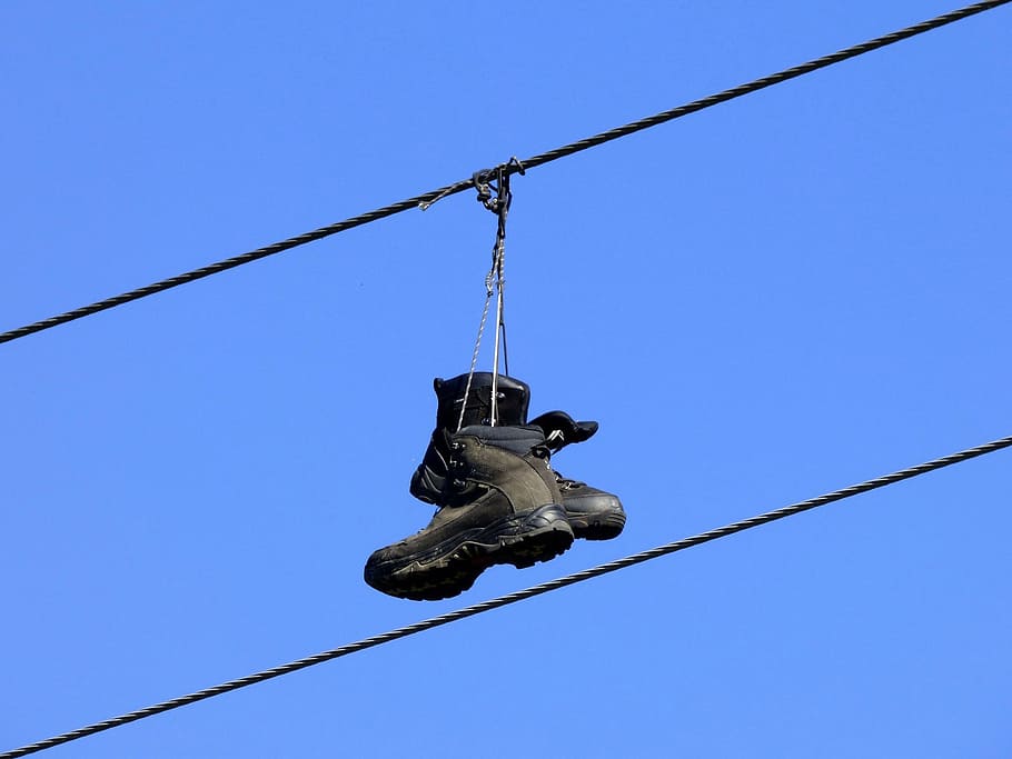 boots, power line, high up, blue, shoes, low angle view, sky, clear sky, nature, cable