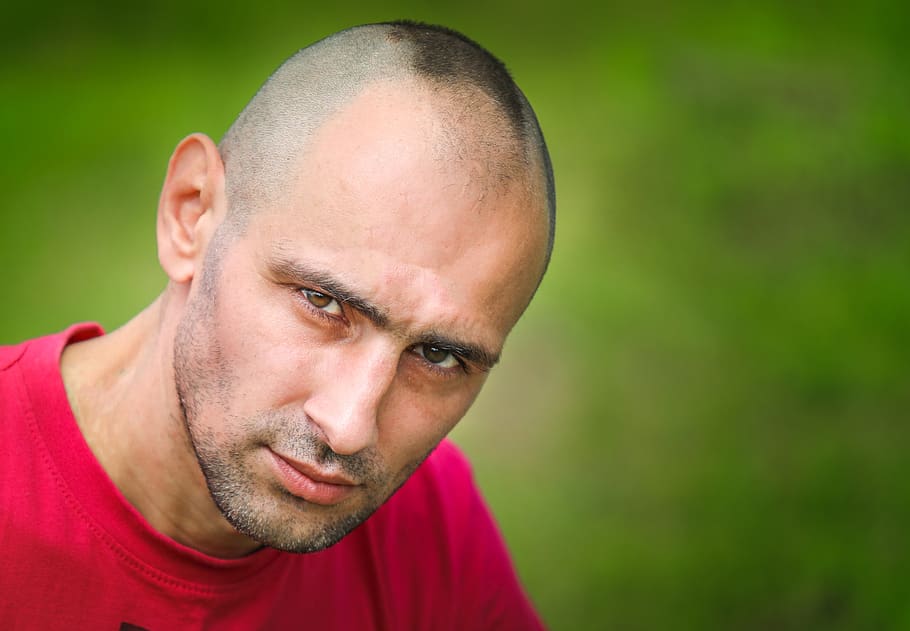 man, boy, serious, outdoors, shaved head, headshot, portrait, one person, close-up, front view