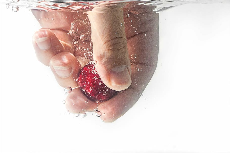 person holding ball, people, hand, water, bubbles, nail, red, fruit, refreshment, white background