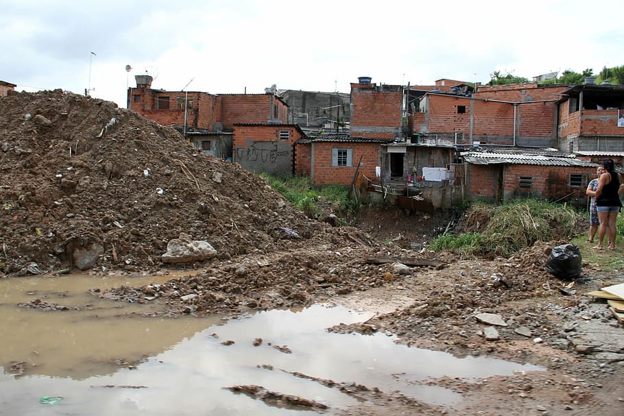 brazil, carapicuiba city, favela brazil, community without sidewalks street, puddle, cul de sac, sewer the open sky, brazilian reality, the real brazil, plash