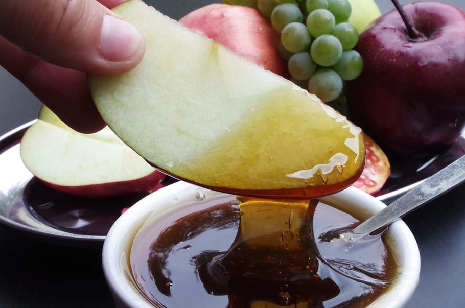 person, dipping, apple slice, honey, new year, the israeli, apple, pomegranate, the feast of the, food and drink