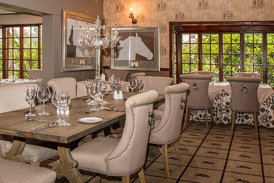 rectangular, brown, wooden, dining table, filled, wine glasses, hotel, dining room, restaurant, elegant