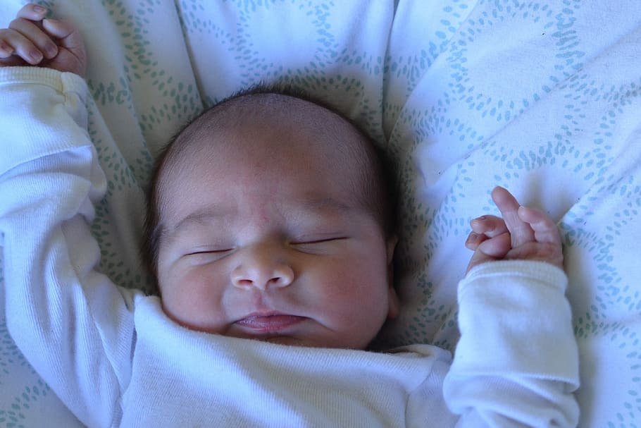 infant, wearing, long, sleeve onesie, sleeping, white, cushion, newborn, photography, sleeve